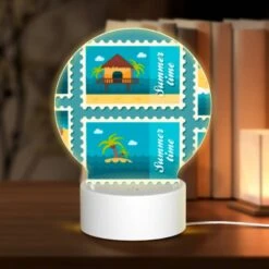 Round Acrylic Night Light, A Collection Of Six Different Colored Postage Stamps Featuring Beach And Tropical Themes.