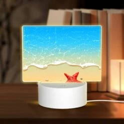 Rectangular Acrylic Night Light, A Red Starfish Is Sitting On A Sandy Beach.