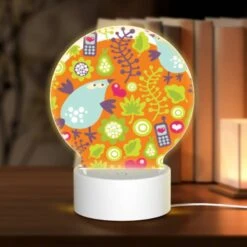 Round Acrylic Night Light, A Colorful Bird With A Cell Phone In Its Mouth.