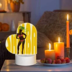Love Acrylic Night Light, A Woman Wearing A Grass Skirt And A Head Dress Stands In Front Of A Yellow Background. -Pattern Diy Shop 70341cf9b1ec8992277396f69c24f19f8765db79