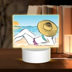Rectangular Acrylic Night Light, A Woman Is Laying On The Beach