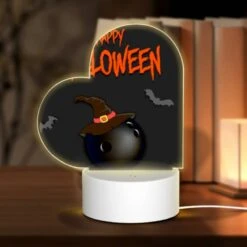 Love Acrylic Night Light, A Black And White Image Of A Bomb With A Witch's Hat On It.