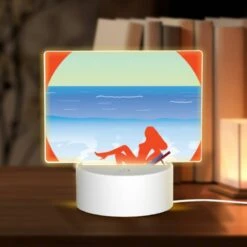 Rectangular Acrylic Night Light, A Woman Is Laying On A Beach Chair