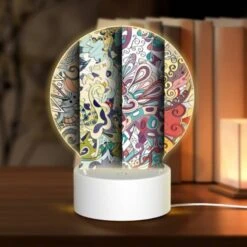 Round Acrylic Night Light, Three Colorful Designs Are Displayed On A Wall.