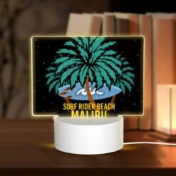 Rectangular Acrylic Night Light, A Surfboard Is Floating On A Wave In Front Of A Palm Tree.