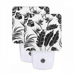 Night Light Set Of 2, A Black And White Image Of A Leafy Plant With A Flower.